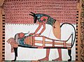 Image 60Anubis, the god associated with mummification and burial rituals, attending to a mummy (from Ancient Egypt)
