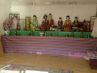 Indoor Asian shrine.