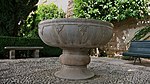 Fountain piece in the garden that was installed in the Court of the Lions in 1624, moved here in 1954