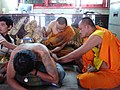 Phra Ajarn Hlwong Pi Nan tattooing at Wat Bang Phra Temple