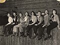 Lineup, Female students in western garb, sitting on a wall.