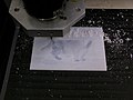 CNC machine cutting lithophane of a cat