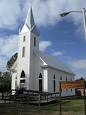 an old church with a large steeple