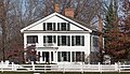 An early, asymmetrical, vernacular example in Michigan, the Marantette House, 1835.