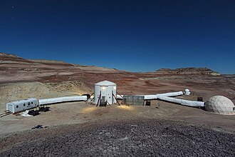 Picture of a mock Mars base on a vast desert