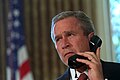 President Bush speaks on the phone to New York's Governor and Mayor respectively, George Pataki and Rudy Giuliani, two days after the September 11 attacks. (Draper, 2001)