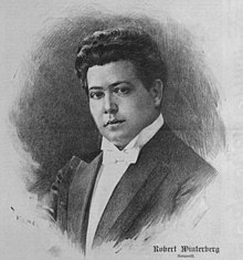 Clean-shaven young man with thick, dark, curly hair, in white-tie evening dress