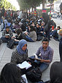 Tunisian students perform reading on the street, on the 2012 World Book Day
