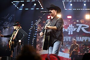 Big Kenny and John Rich of Big & Rich, performing on stage.