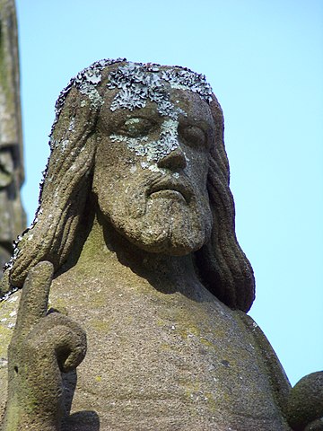 The "Risen Lord" has emerged from the tomb and gives a blessing