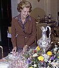 Ford reviews the table settings while preparing for the September 21, 1976 state dinner in honor of Liberian President William Tolbert.