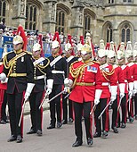 Full dismounted dress of the Household Cavalry: the Blues and Royals (left) and the Life Guards (right).