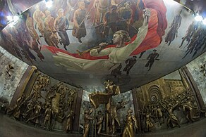 Interior of one of the museum's rooms where there are several statues and paintings.