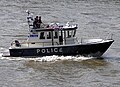 A Metropolitan Police launch on the River Thames in London
