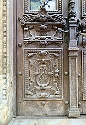 Romanesque Revival monogram on the entrance door of the Monteoru House, Bucharest, designed by Ion Mincu or Nicolae Cuțarida, 1887-1889