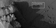 Very close view of individual blocks breaking off layer in a butte, as seen by HiRISE under HiWish program Blocks have angular shapes. Box shows size of football field.