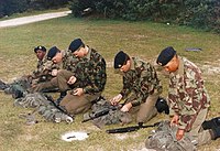 Royal Bermuda Regiment recruits in 1993 wearing green lightweight trousers, green shirts and sweaters, with 1968 Pattern DPM combat jackets, berets, and DMS high-boots and equipped with 1958 Pattern carrying equipment