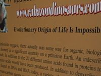 A poster details arguments against evolutionism and concludes "Evolutionary Origin of Life Is Impossible."