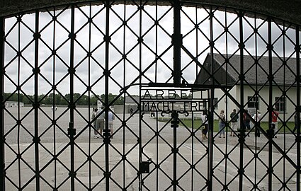 The main gate at Dachau concentration camp, marked with the slogan Arbeit macht frei