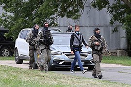 GIGN operators escorting a VIP during a demo - 2021