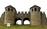 Stone gate with two towers and two arched passes