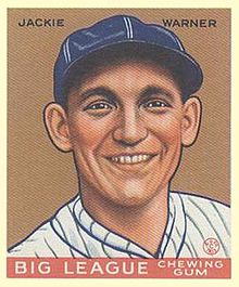 A baseball card image of a smiling man wearing a blue baseball cap