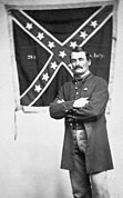 Marshall Sherman with the 28th Virginia battle flag