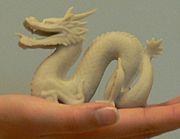 A 3D-printed reproduction of Stanford dragon (1996) physical model, made through rapid prototyping
