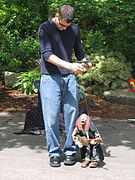 A puppeteer manipulating a marionette