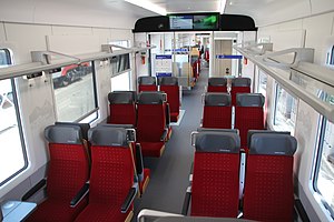 Rows of red-upholstered seats