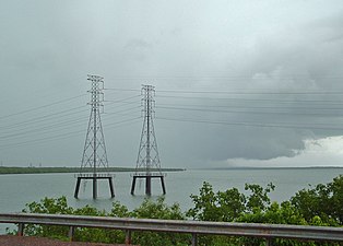 Three-phase alternating current transmission towers over water, near Darwin, Northern Territory, Australia
