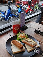 Two Dutch kroketten, one cut open to show the beef-ragout filling; Chiang Mai, Thailand