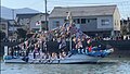 Boat carrying men in fundoshi during Horan-enya