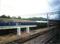 A picture of a green preserved and a blue and white BR regional railways Mk1 carnage's in Crewe during 2000. The aging Mark 1 carriages were being phased out at the time of privatisation due to the superstructures detached from their underframes on impact and disintegrated in the collision.