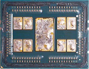 AMD EPYC 7702 after delidding, with remains of solder thermal interface material (TIM).