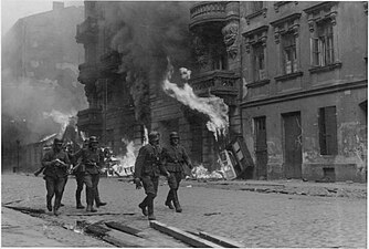 NARA copy #11, IPN copy #13 An assault squad Waffen SS troops at Nowolipie Street with Nowolipie 50 A, 52, 54 and 56 in the back.