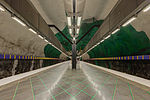 Platform with artwork on the tunnel walls