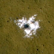 Ice exposed in a fresh crater. These deposits have been found to disappear over time.