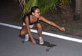 Skater riding a hybrid longboard