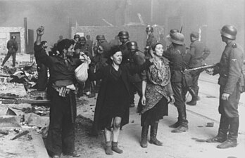 NARA copy #18 These bandits offered armed resistance Nowolipie 64 near intersection with Smocza.Woman on the right: Hasia Szylgold-Szpiro