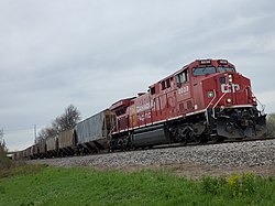 A Canadian Pacific locomotive leads a train through Duplainville on May 2, 2020.