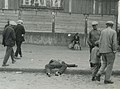 Passers-by ignore the corpse of a starved man on a street in Kharkiv, Ukraine, 1932