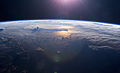 Image 101Sunset over the Pacific Ocean as seen from the International Space Station. Tops of thunderclouds are also visible. (from Pacific Ocean)