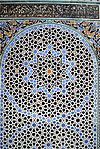 Geometric patterns in zellij tilework at the Al-Attarine Madrasa in Fes (14th century)
