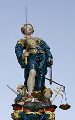 Lady Justice with sword, scales and blindfold on the Gerechtigkeits­brunnen in Bern, Switzerland, 1543