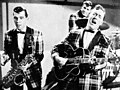 Image 12Bill Haley and his Comets performing in the 1954 Universal International film Round Up of Rhythm (from Rock and roll)