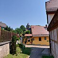 Ortsansicht mit Gasthaus und Kirche