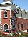 Image 30Statue in Fremantle of an Australian rules footballer taking a spectacular mark (from Culture of Australia)