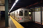 An R train on the Fourth Avenue Line at 86th Street station in September 2018