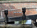 The lower lock gate of Brades Lock showing the bridge sign.